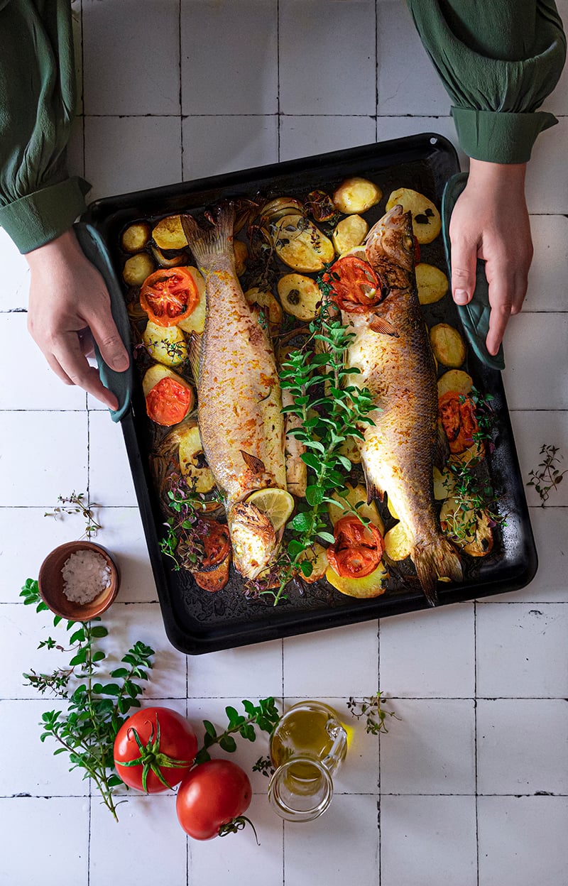 Oven-Baked Sea Bass with Potatoes, Tomato, and Herbs - Recipe image